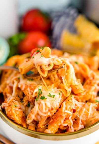 This Instant Pot Chicken Parmesan Pasta comes together in just 25 minutes for a quick weeknight dinner option loaded with tomato sauce, cheese, and chicken that everyone will love!
