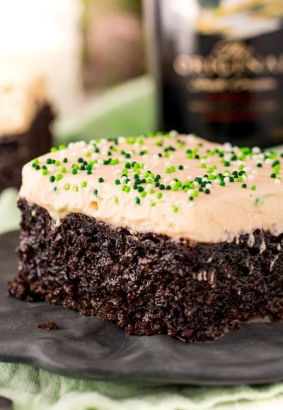 Close up photo of chocolate irish cream cake on a black plate.