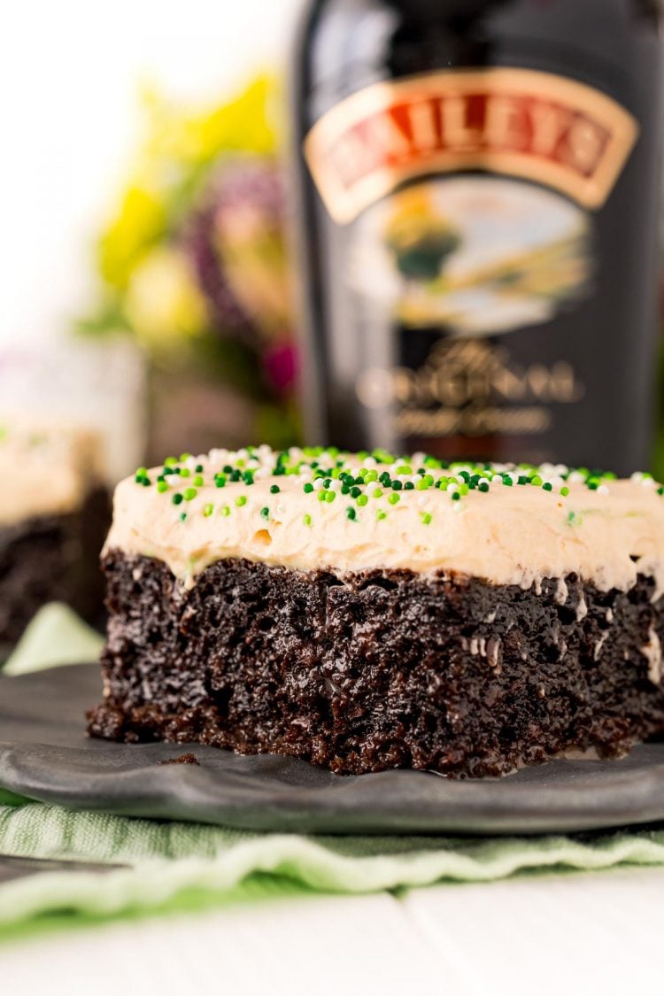 Close up photo of Irish cream cake on a gray plate.