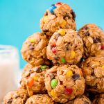 Close up photo of a stack of Monster Cookie Protein balls.