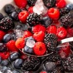 Close up photo of nature's cereal made with berries in a white bowl.