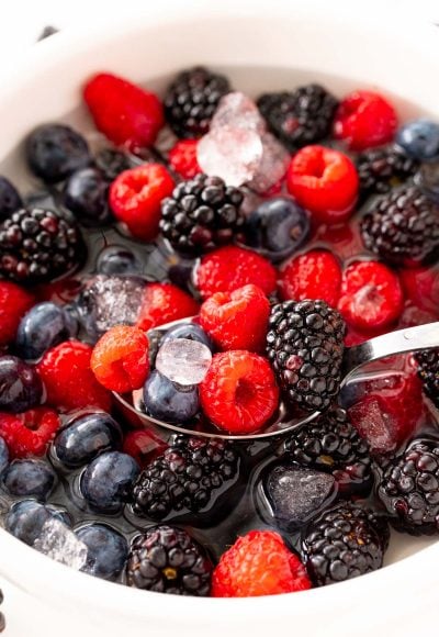 Close up photo of nature's cereal made with berries in a white bowl.