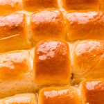 Close up photo of yeast rolls in a pan.