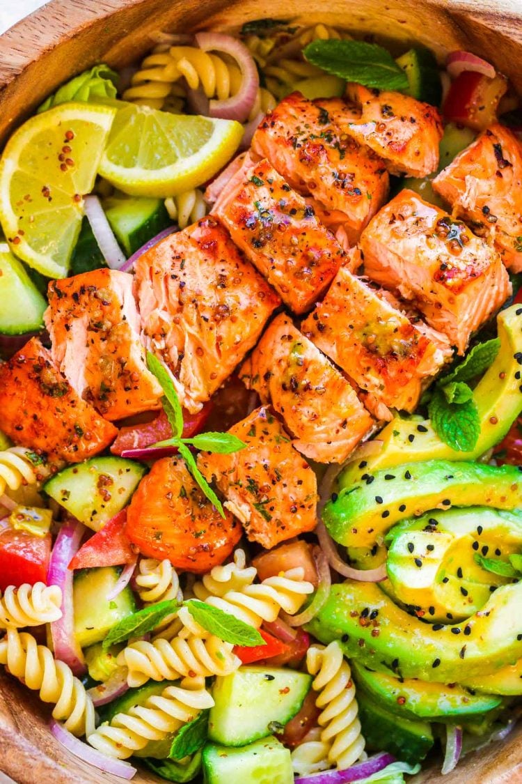 Close up photo of a salmon pasta salad.