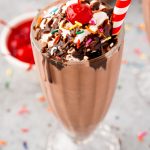 Close up photo of a chocolate milkshake.