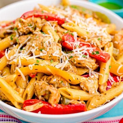 Close up photo of a bowl of Rasta Pasta on a colorful linen napkin.