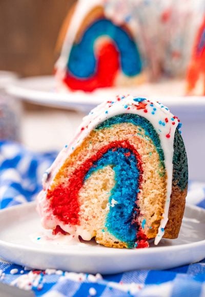 Close up photo of a slice of 4th of july red, white, and blue bundt cake.