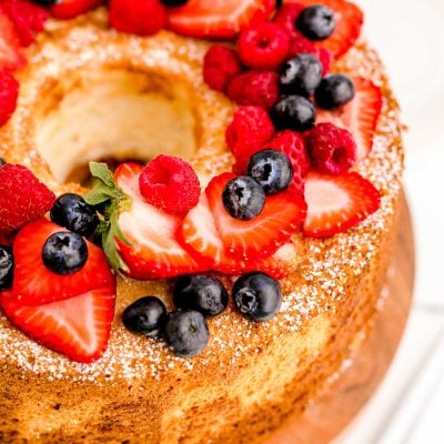 Close up photo of angel food cake topped with fresh berries.
