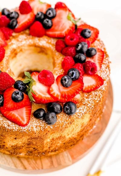 Close up photo of angel food cake topped with fresh berries.