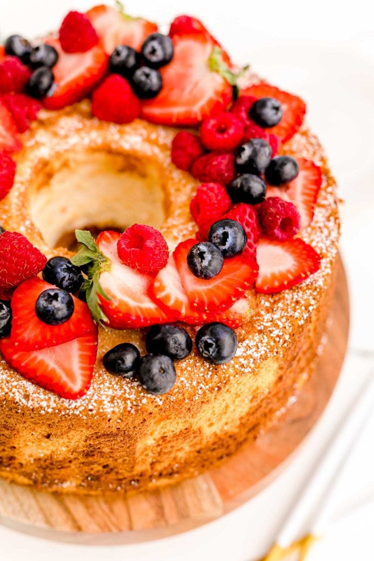 Close up photo of angel food cake topped with fresh berries.