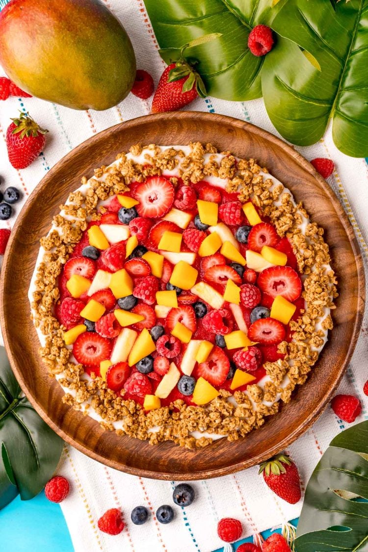 Close up photo of Nature's pizza on a wooden plate.