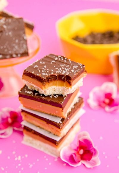 Close up photo of a stack of millionaire shortbread bars.