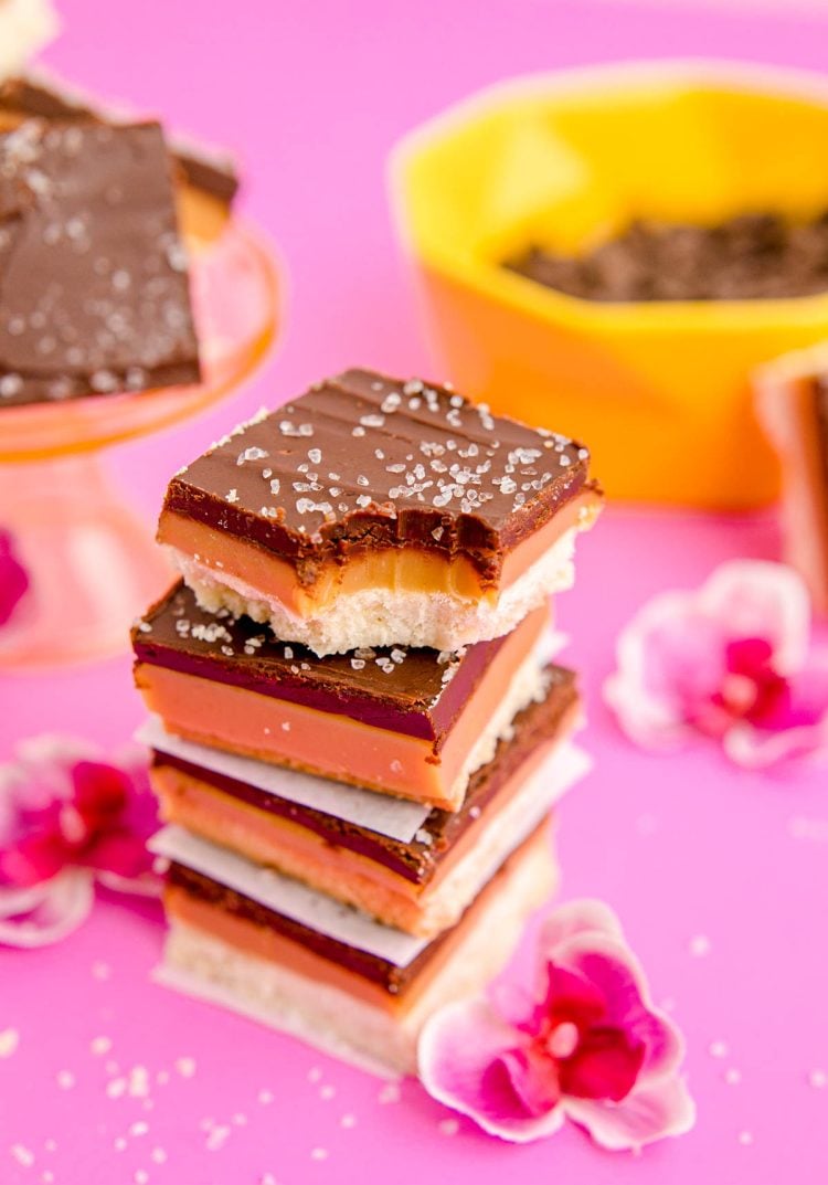 Close up photo of a stack of millionaire shortbread bars.