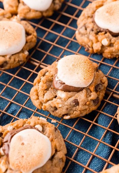 Close up photo of s'mores cookies on a copper wire rack.