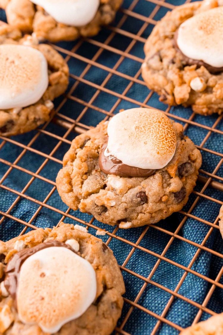 Close up photo of s'mores cookies on a copper wire rack.