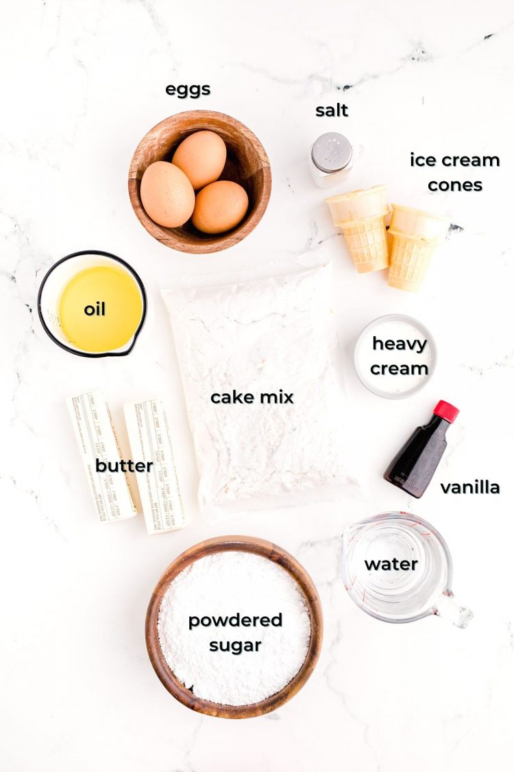 Ingredients to make ice cream cone cupcakes prepped on a white table.