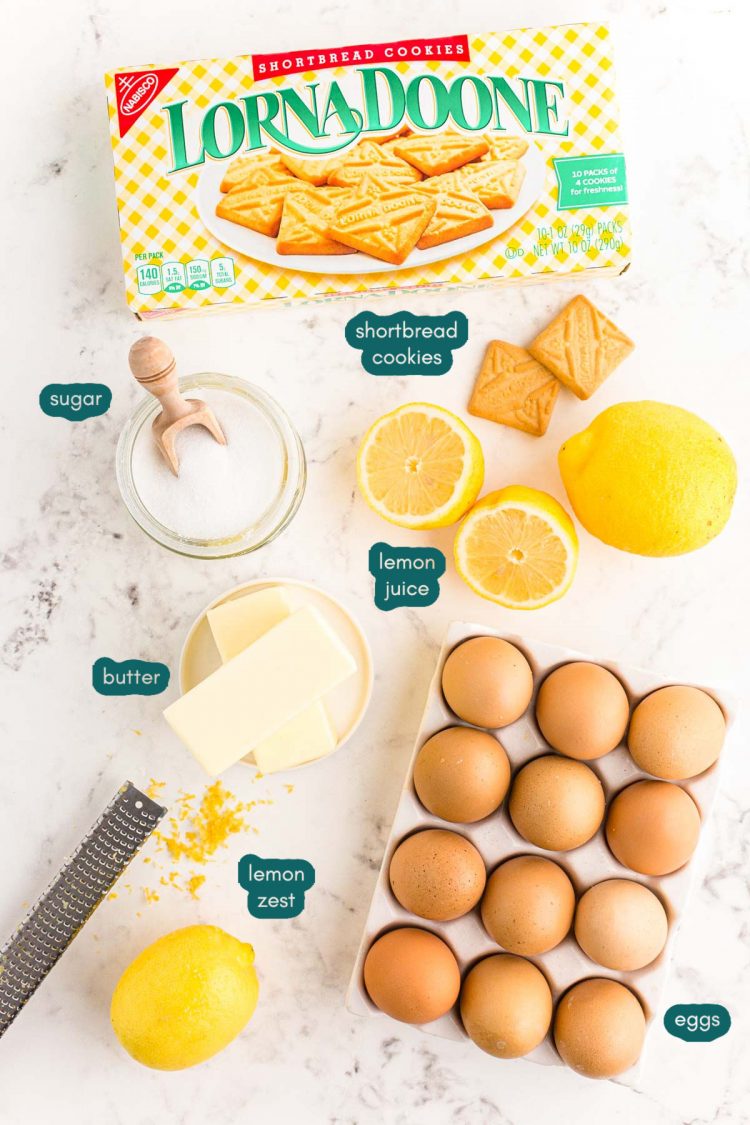 Overhead photo of ingredients to make a lemon tart on a marble counter.