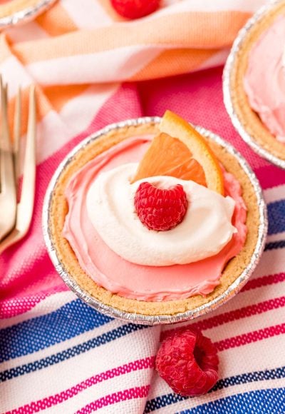 Close up photo of kool-aid pie on a pink and blue striped napkin.