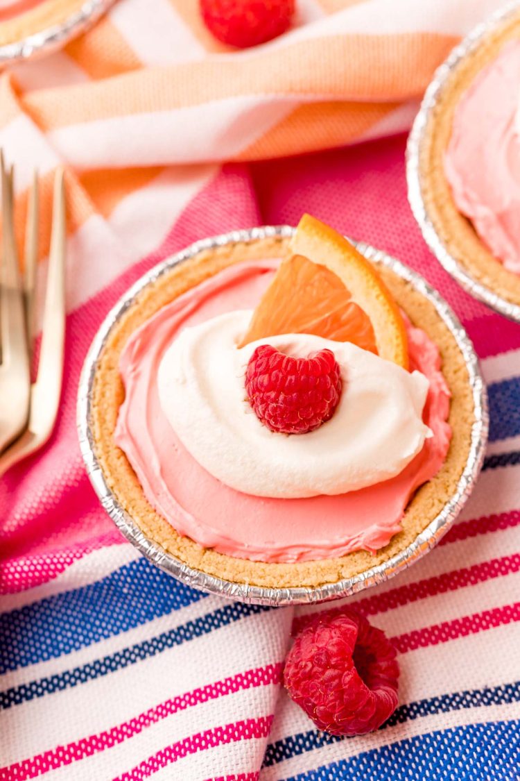 Close up photo of kool-aid pie on a pink and blue striped napkin.