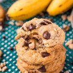 Close up photo of a stack of four banana bread cookies with the top one missing a bite.