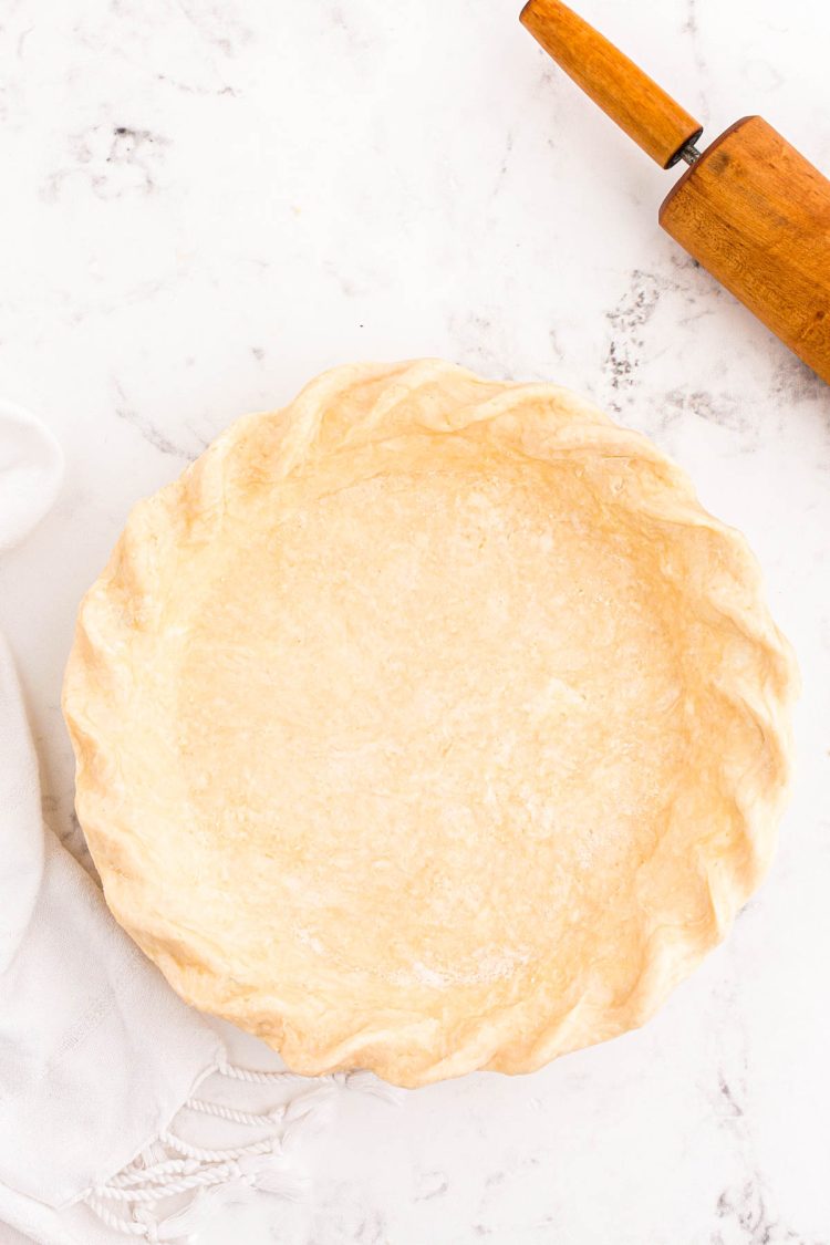 Overhead photo of a cream cheese pie crust ready to be baked.