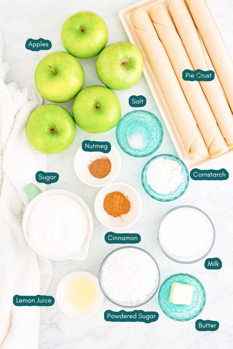Overhead photo of ingredients prepared to make apple slab pie on a marble table.