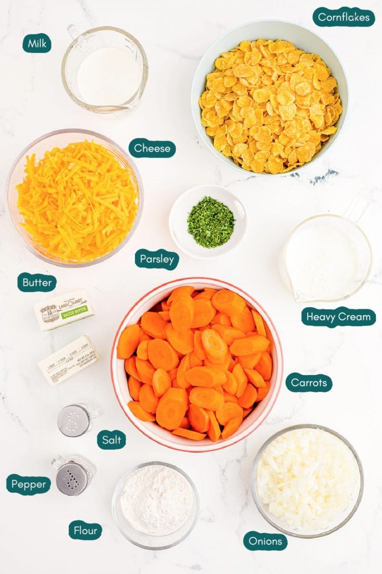 Overhead photo of ingredients prepared to make carrot casserole on a marble table.