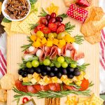 Overhead photo of a Christmas Tree Charcuterie board on a wooden table.