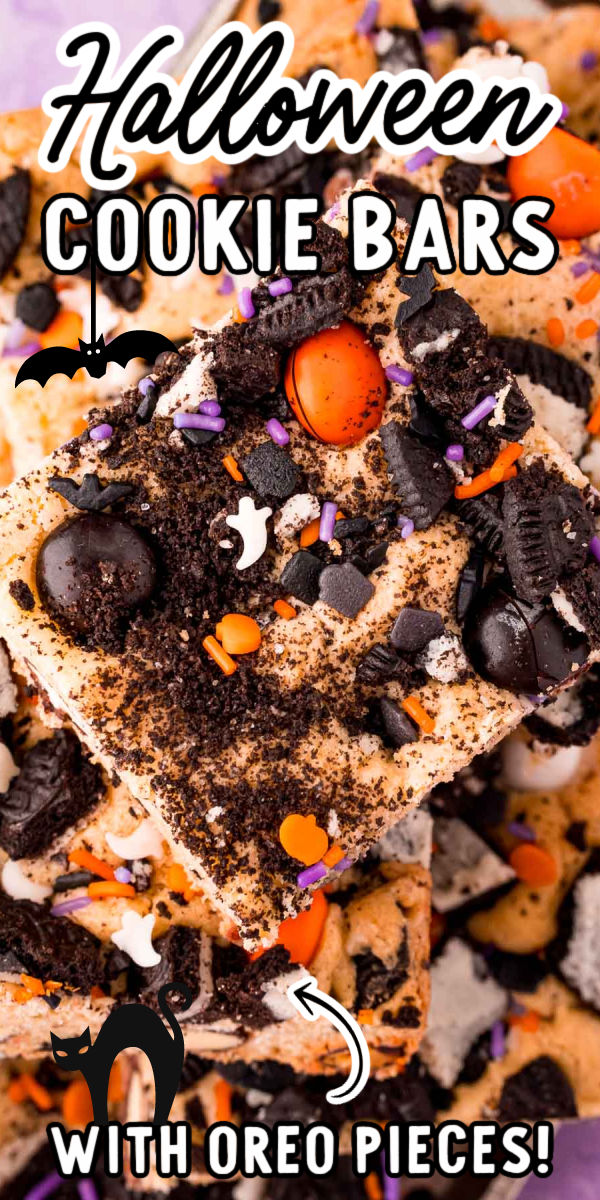 Halloween Cookies & Cream Cookie Bars is an easy-to-make dessert that's filled with Oreo pieces and Halloween M&Ms and ready to enjoy in 35 minutes!  via @sugarandsoulco