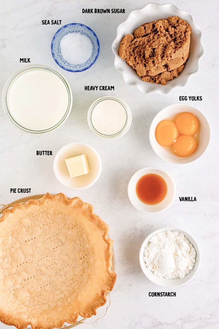 Overhead photo of ingredients to make butterscotch pie prepped on a marble counter.