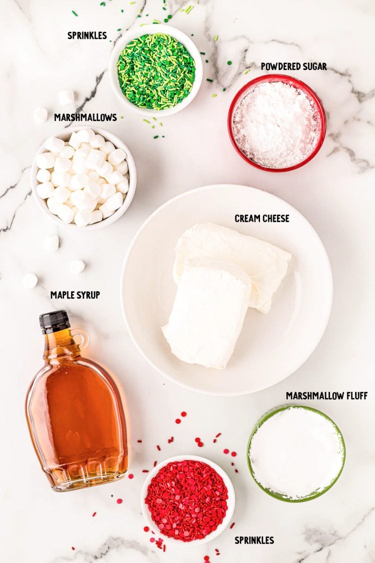 Overhead photo of ingredients to make elf inspired christmas dip on a marble surface.