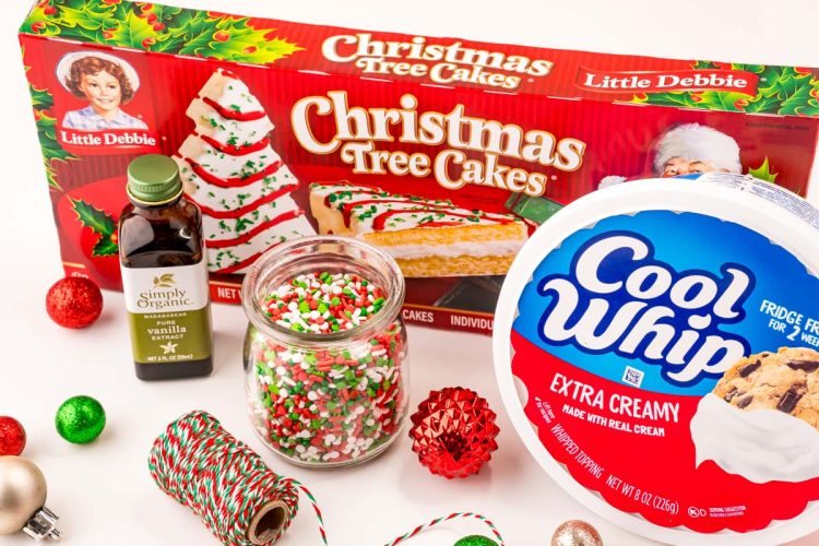 Ingredients used to make Christmas tree cake dip on a white table.