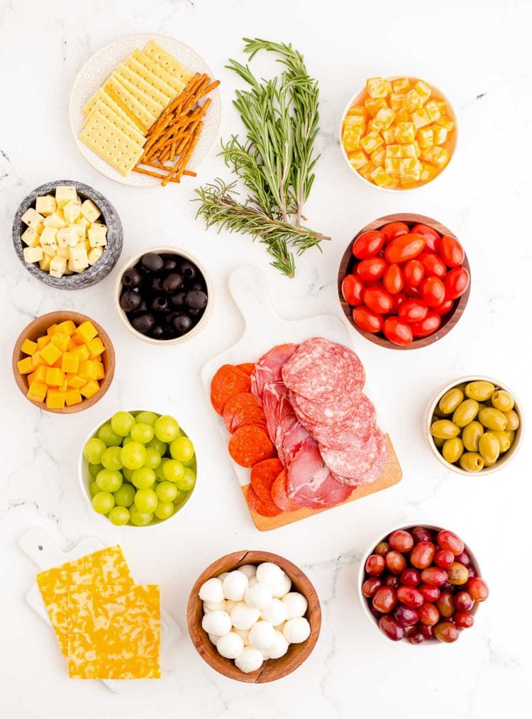 Overhead photo of ingredients used to make a Christmas Tree shaped charcuterie board.