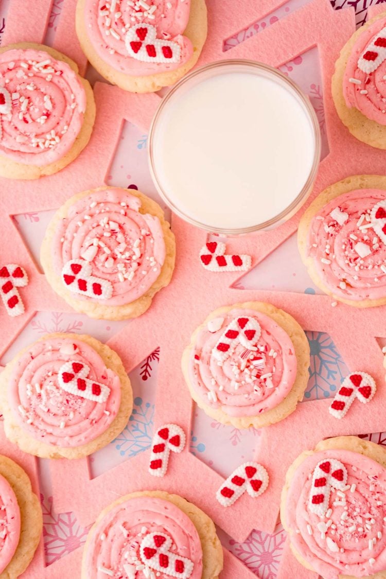 Overhead photo of pink peppermint cookies on a pink placemat.