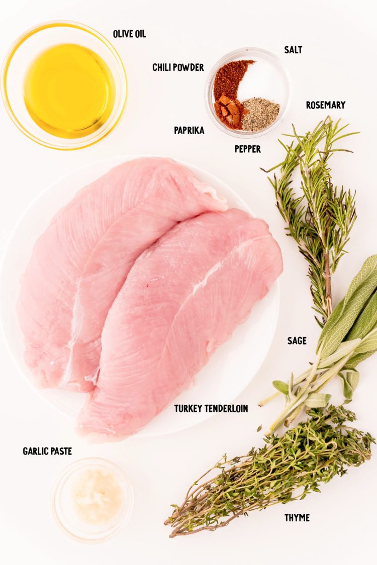 Overhead photo of ingredients prepped to make turkey tenderloin on a white table.