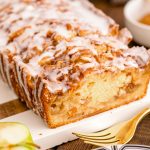 Close up photo of Apple Fritter Bread on a wood and marble cutting board.