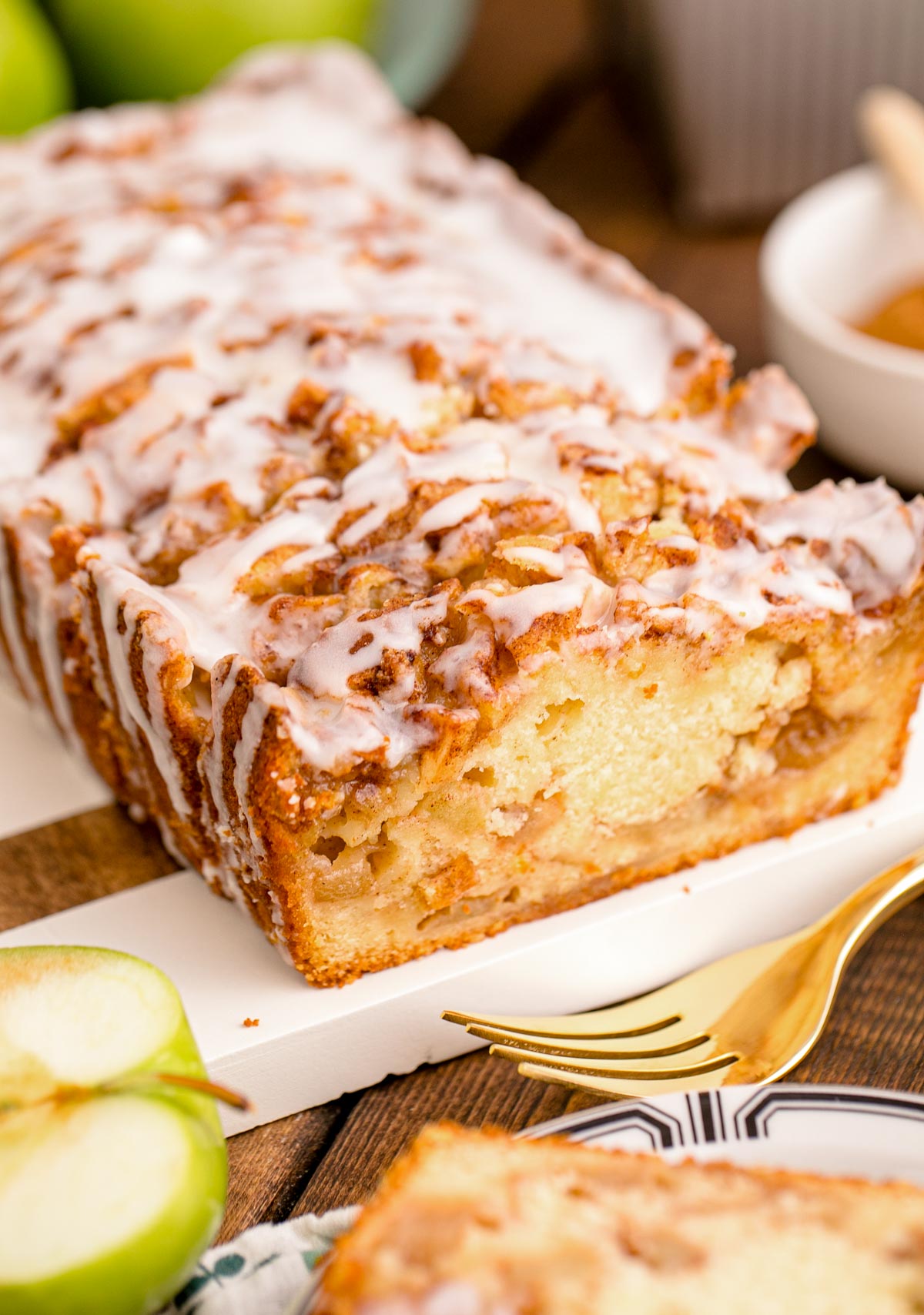 Close up photo of Apple Fritter Bread on a wood and marble cutting board.