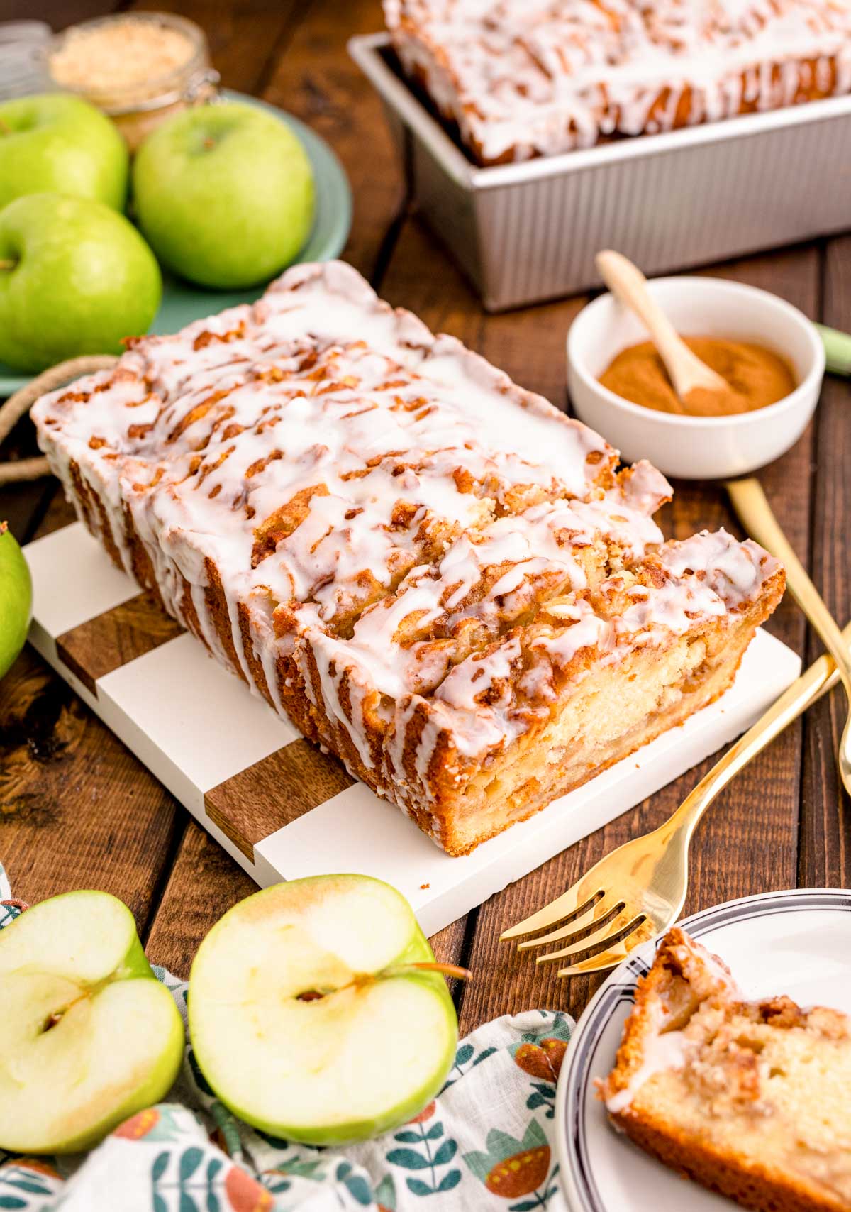 Close up photo of Apple Fritter Bread on a wood and marble cutting board.