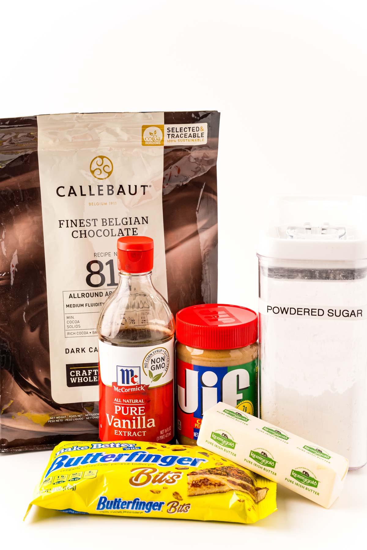 Ingredients to make butterfinger balls on a white table.