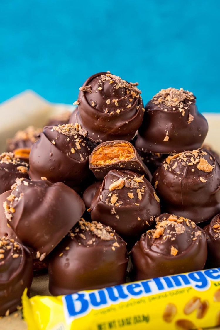 Butterfinger balls stacked in a pile.