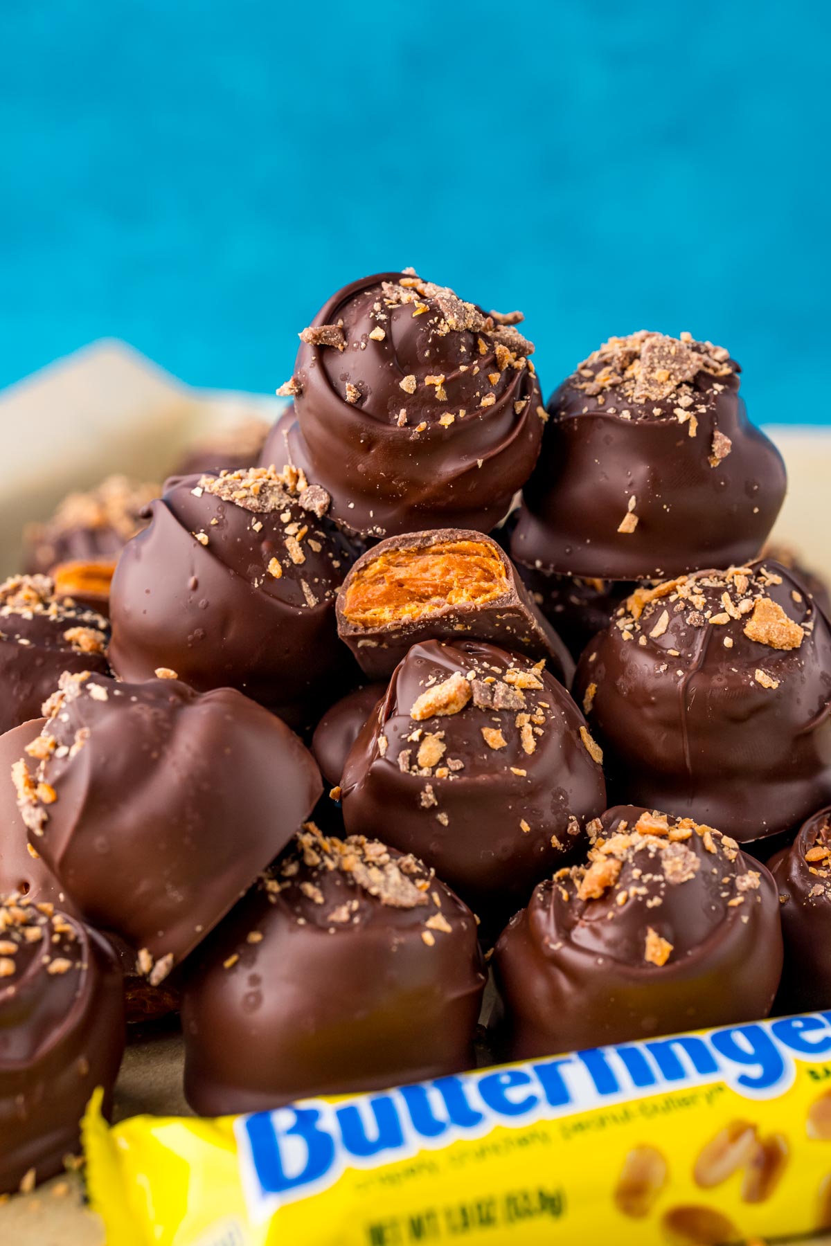 Butterfinger balls stacked in a pile.
