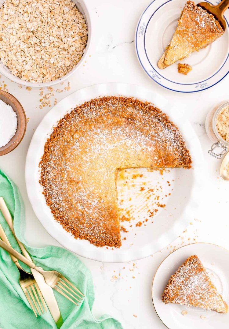 Overhead photo of Milk Bar Crack Pie on a white table with a slice missing.