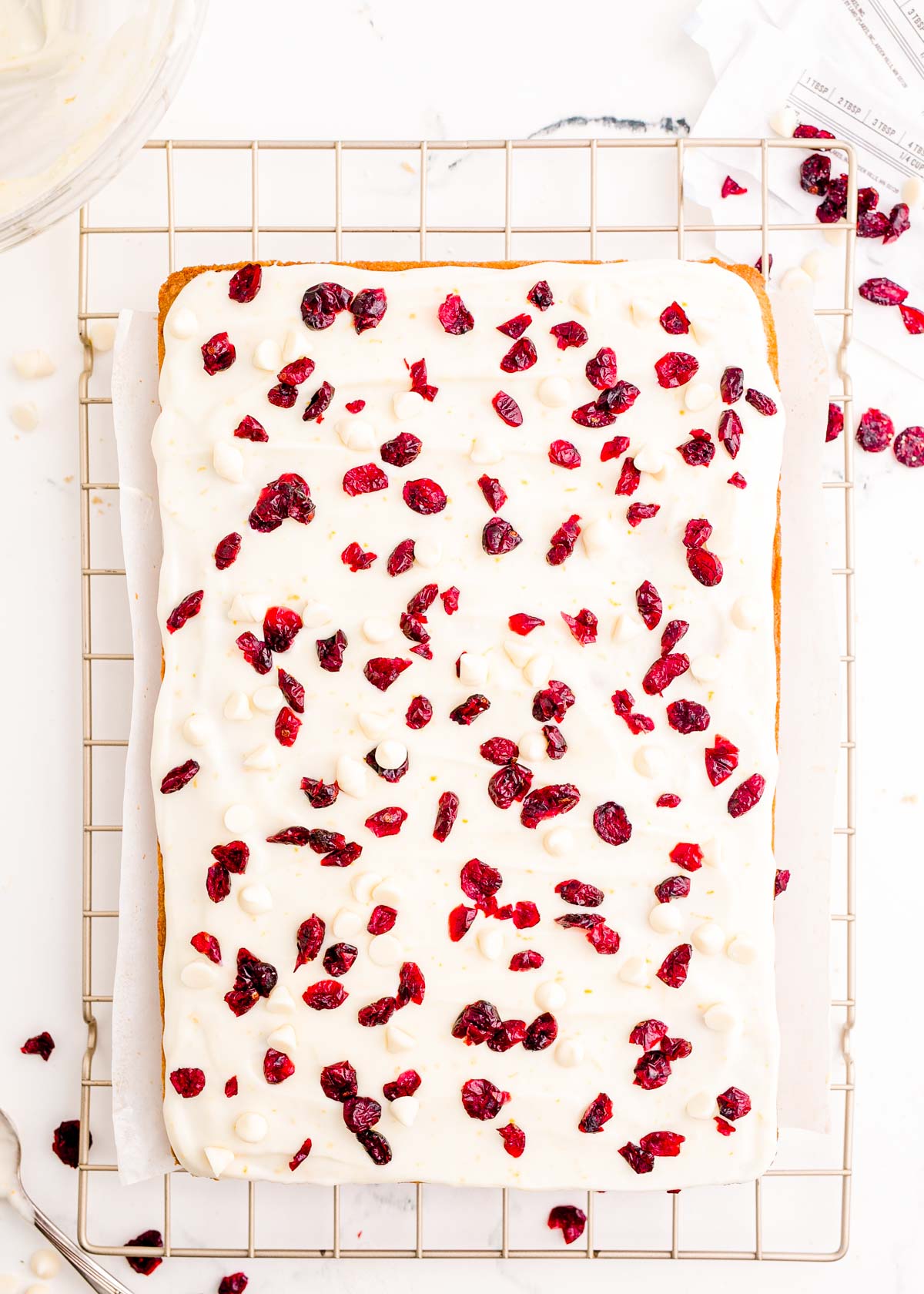 Cranberry bliss bars on a wire rack.