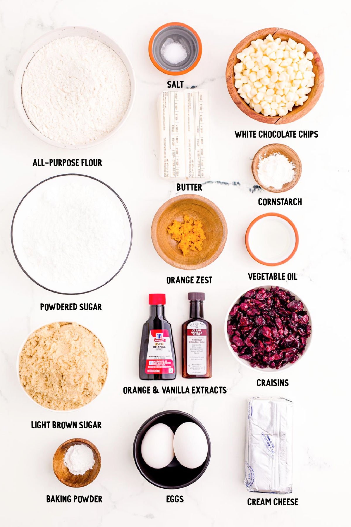 Overhead photo of ingredients prepped to make Cranberry Bliss Bars on a marble surface.