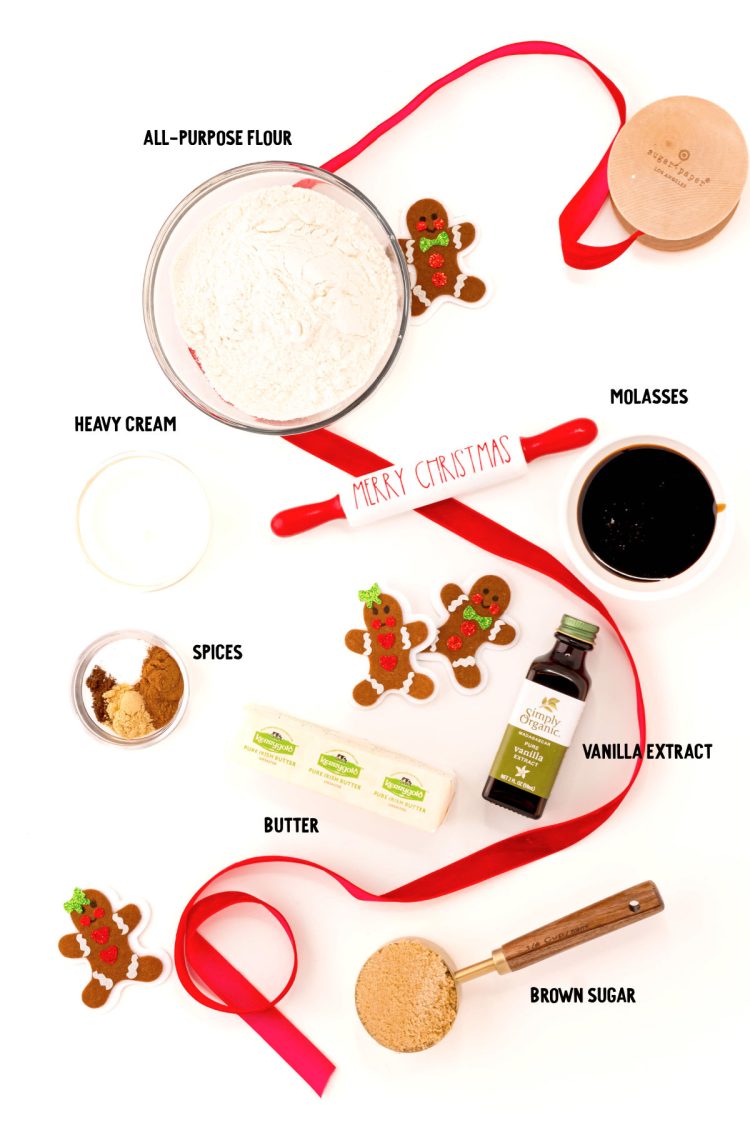 Overhead photo of ingredients prepped to make edible gingerbread cookie dough on a white surface.