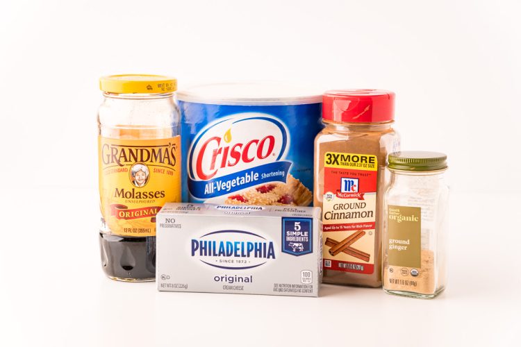 Ingredients used in gingerbread bars on a white table.