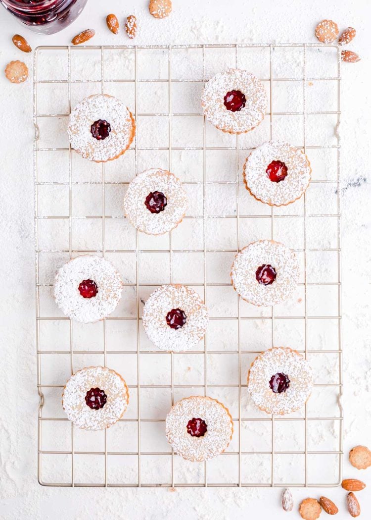 Overhead photo of linzer cookies on a wire rack.
