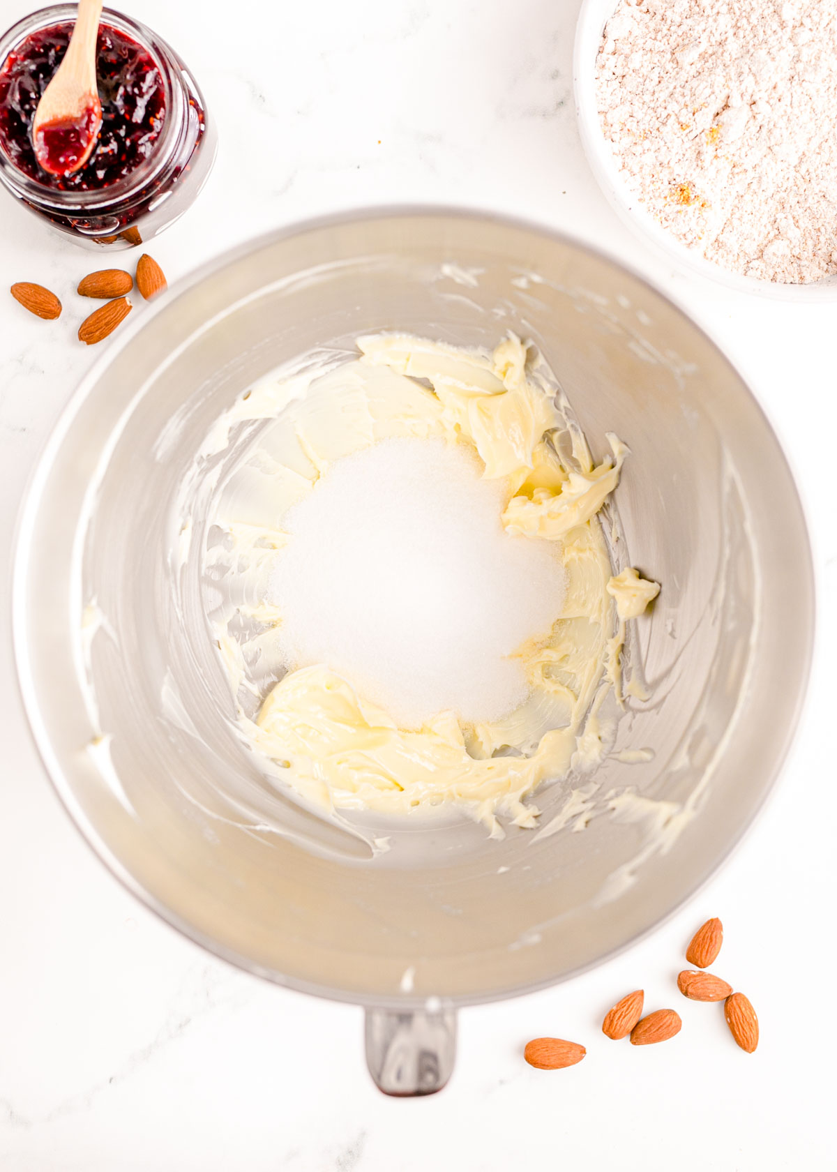 Butter and sugar in a large mixing bowl ready to be creamed.