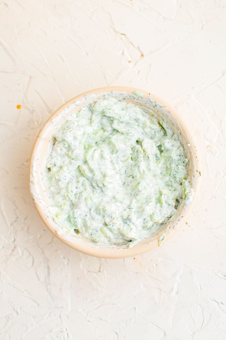 Tzatziki sauce in a white bowl.