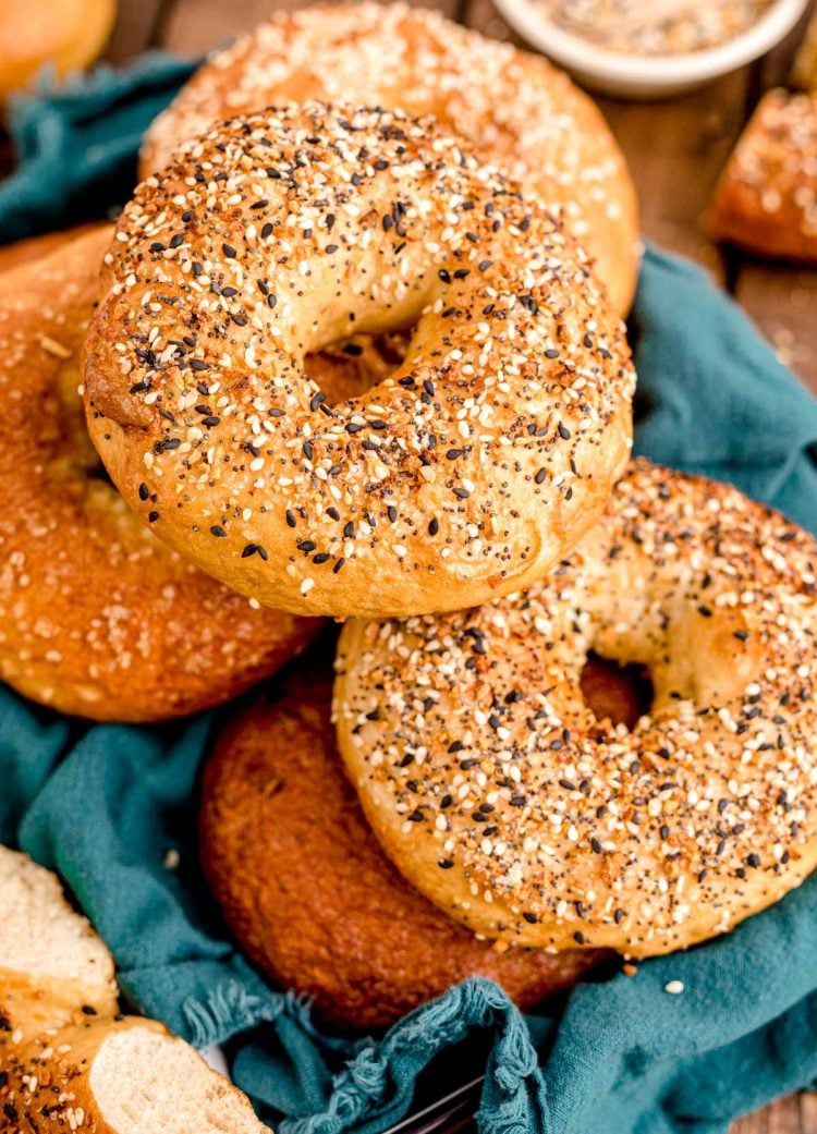 Close up photo of homemade everything bagels on a wooden table.